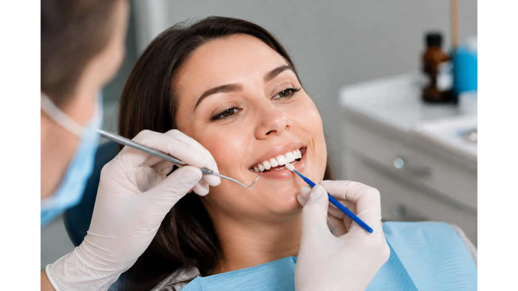 Dentist performing dental bonding treatment on a patient’s teeth