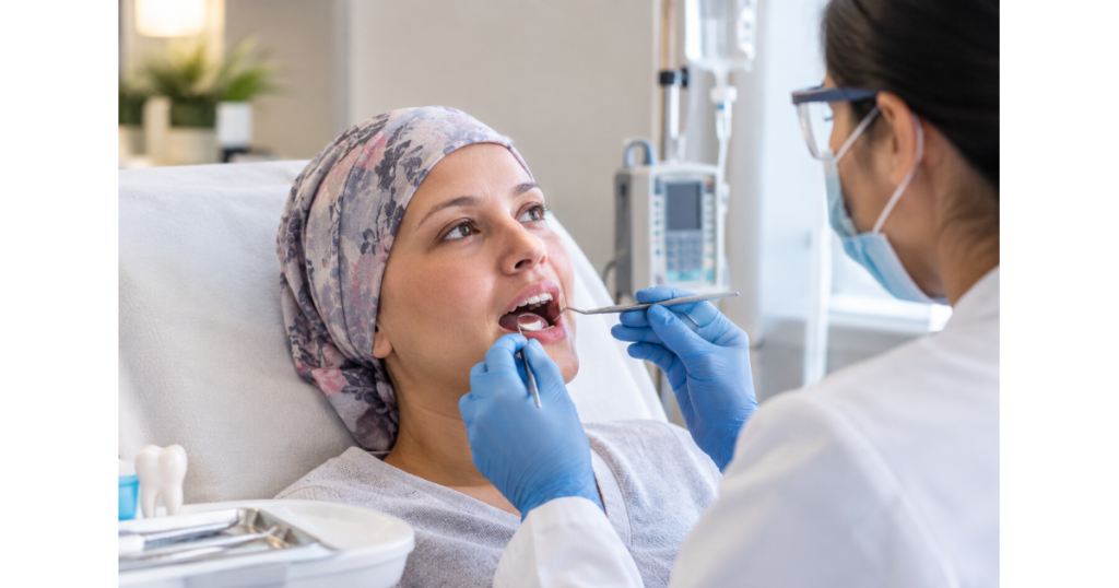 Dentist examining a chemotherapy patient for dental issues