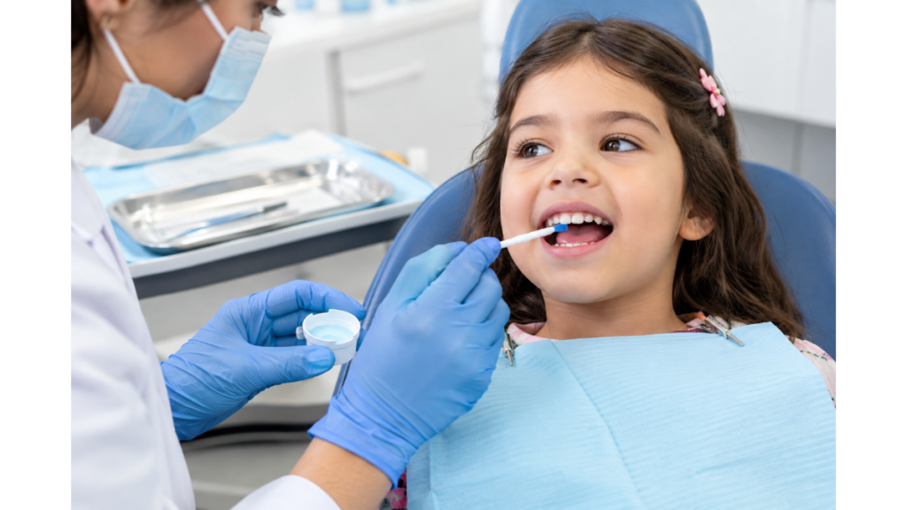 Dental fluoride treatment for children at a dental clinic